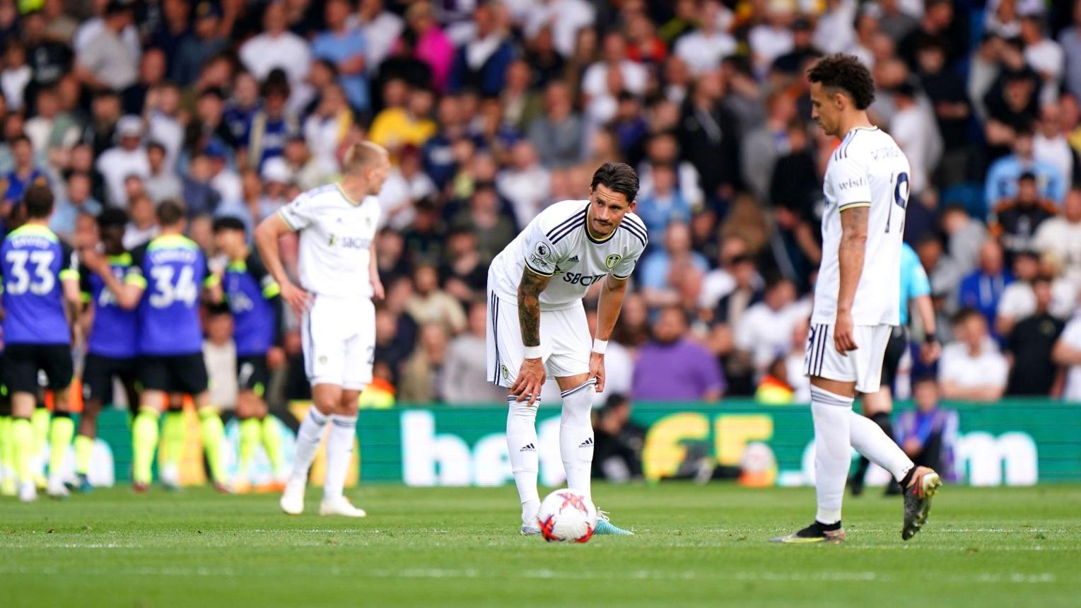 Leeds United players after the 4–1 defeat to Tottenham confirmed relegation in May 2023
