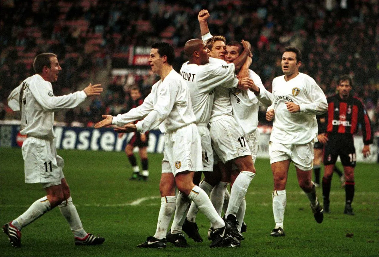 Leeds United players celebrate Dominic Matteo’s first-half header at the San Siro